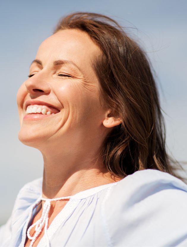 A woman feeling energuzed after getting a B12 Injection in Ballantyne, NC.
